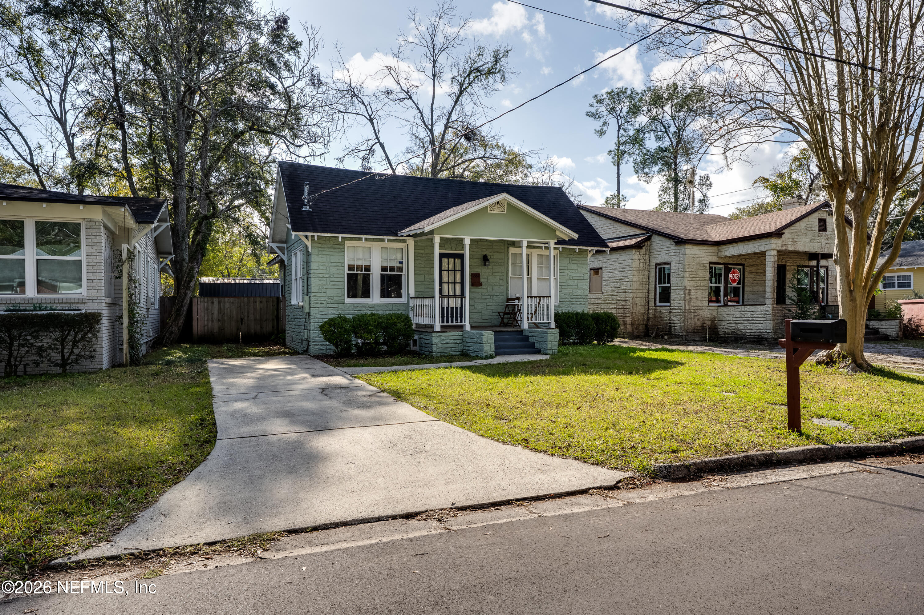 4560 French Street Jacksonville, FL 32205 - Photo 2 of 38 a front view of a house with a yard and garage