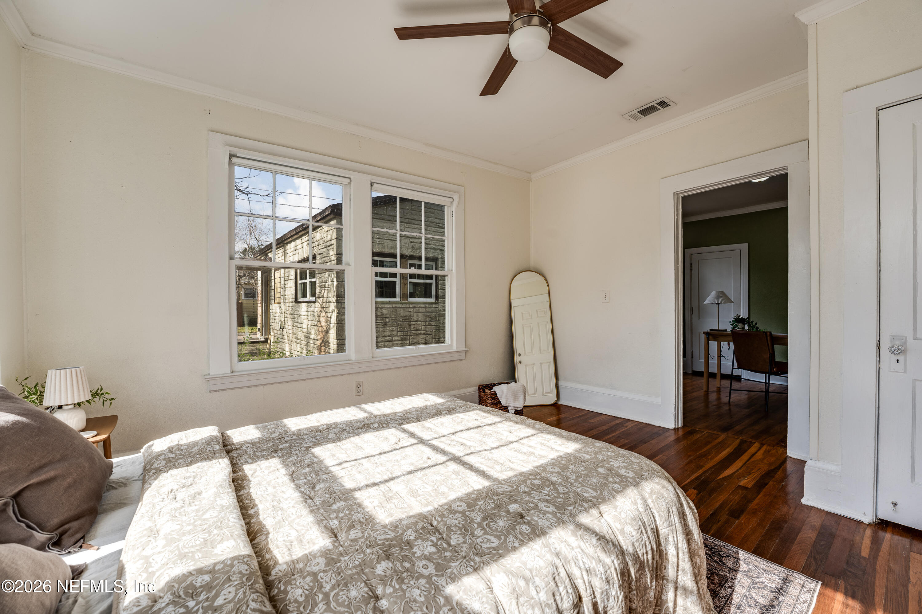 4560 French Street Jacksonville, FL 32205 - Photo 24 of 38 a bedroom with a bed and a large window