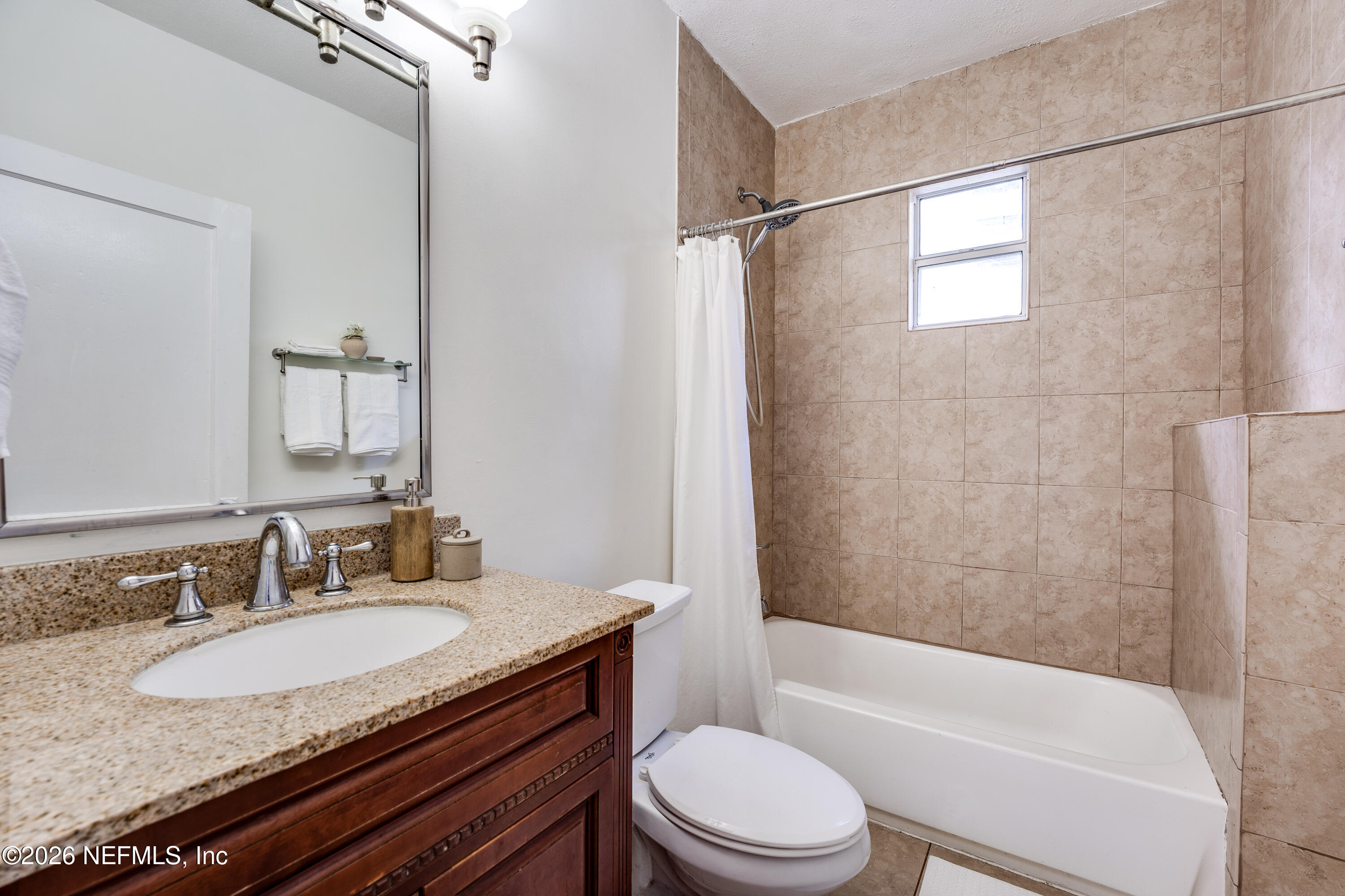 4560 French Street Jacksonville, FL 32205 - Photo 25 of 38 a bathroom with a granite countertop sink toilet and shower