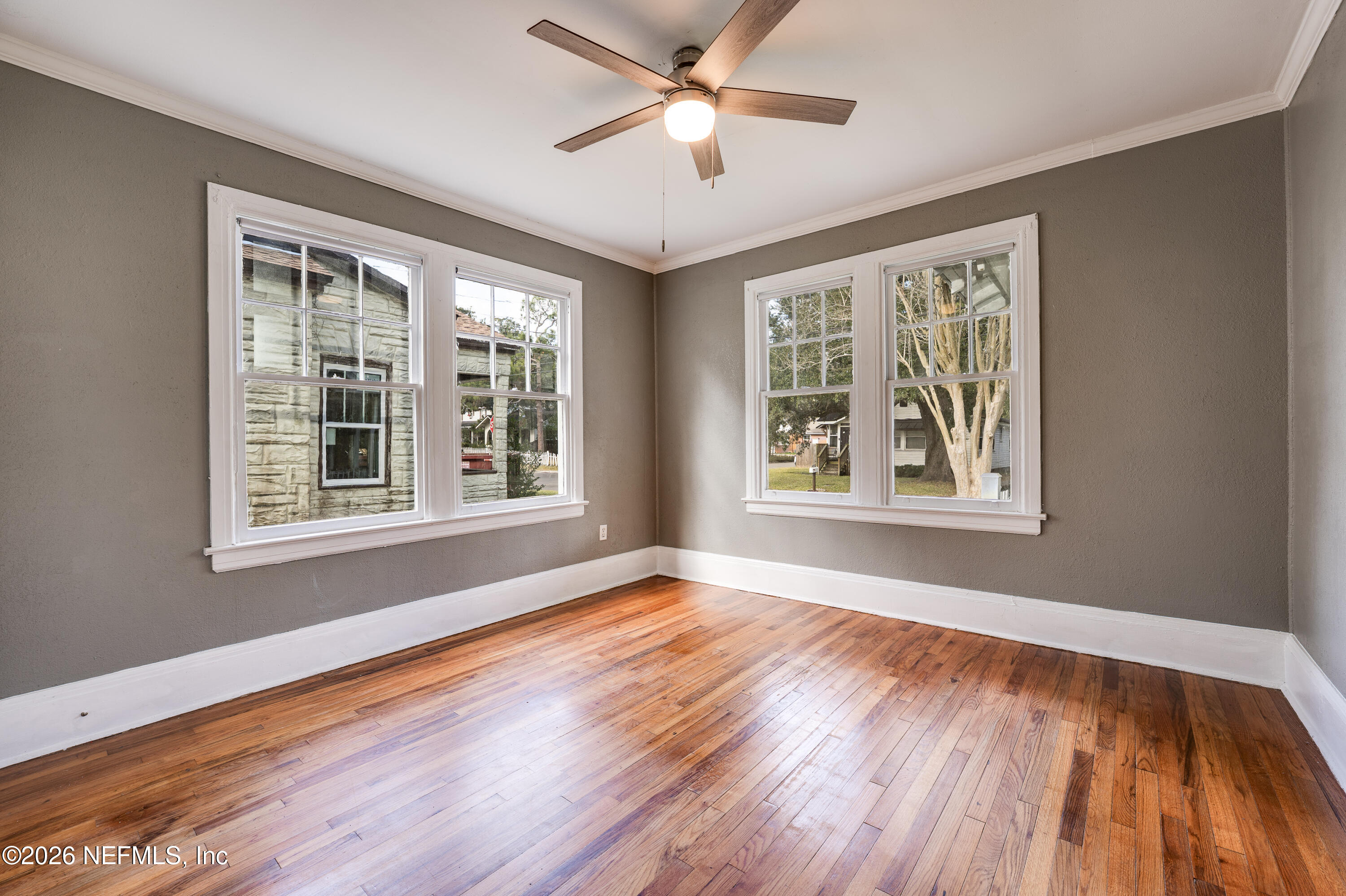 4560 French Street Jacksonville, FL 32205 - Photo 26 of 38 a view of an empty room with wooden floor and a window
