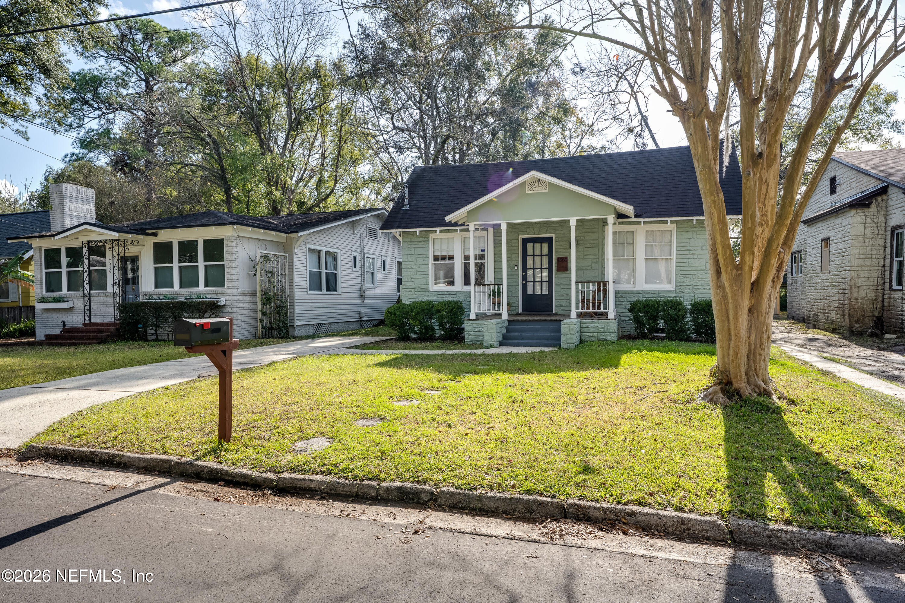 4560 French Street Jacksonville, FL 32205 - Photo 4 of 38 a front view of a house with swimming pool yard and outdoor seating