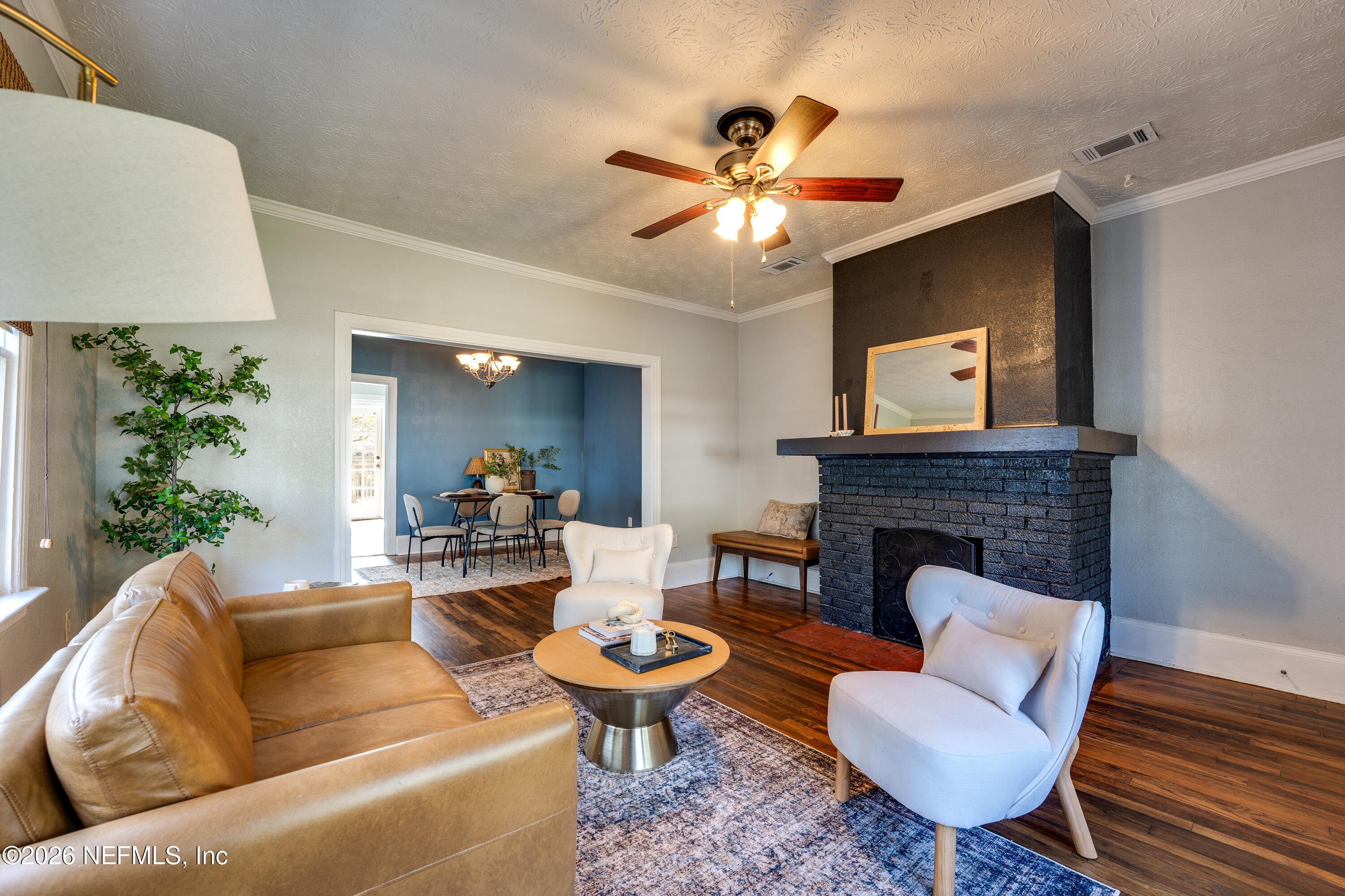 4560 French Street Jacksonville, FL 32205 - Photo 7 of 38 a living room with furniture and a fireplace
