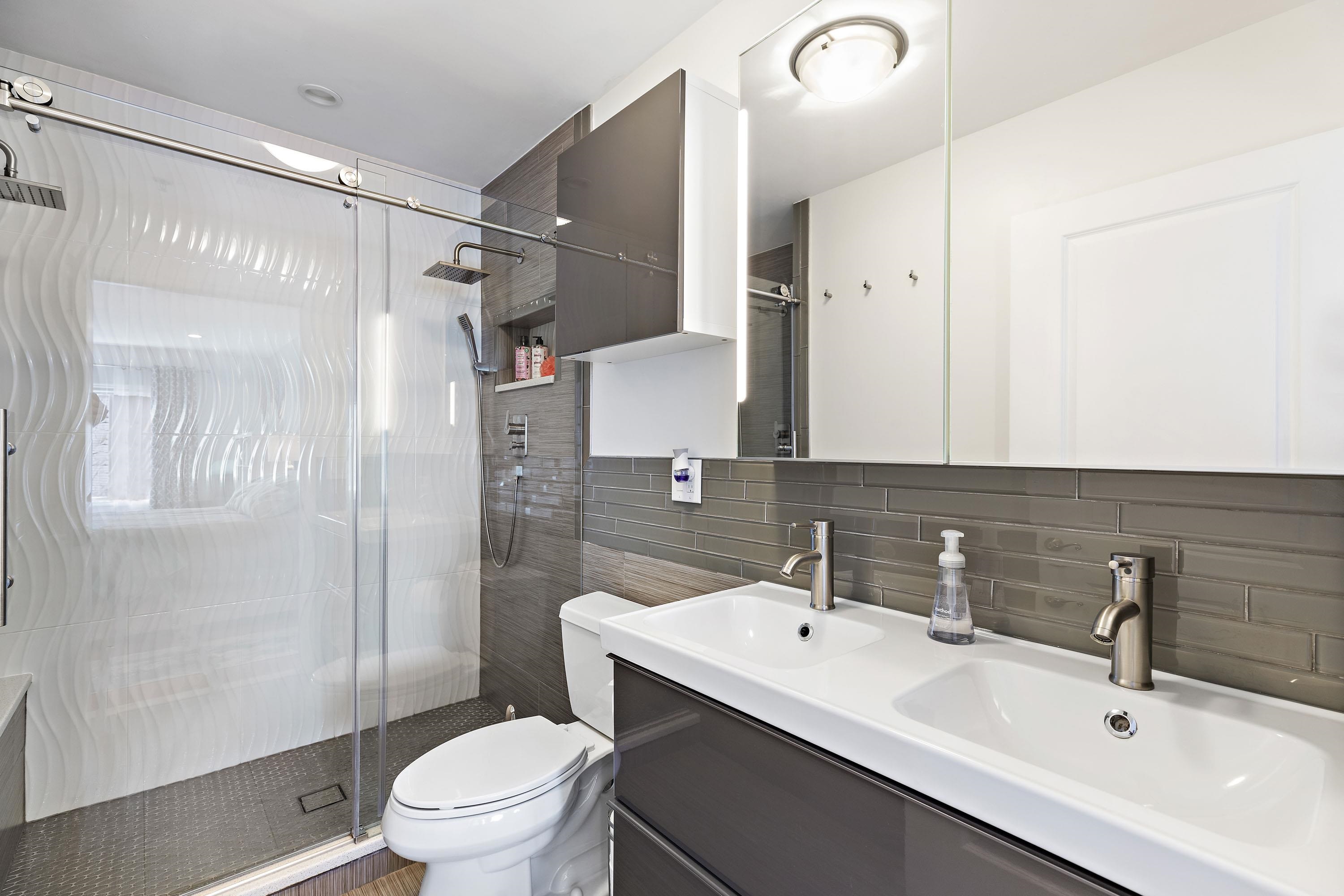 203-207 Hackensack Plank Road, Unit 4B Weehawken, NJ 07086 - Photo 15 of 27 a bathroom with a sink toilet and shower