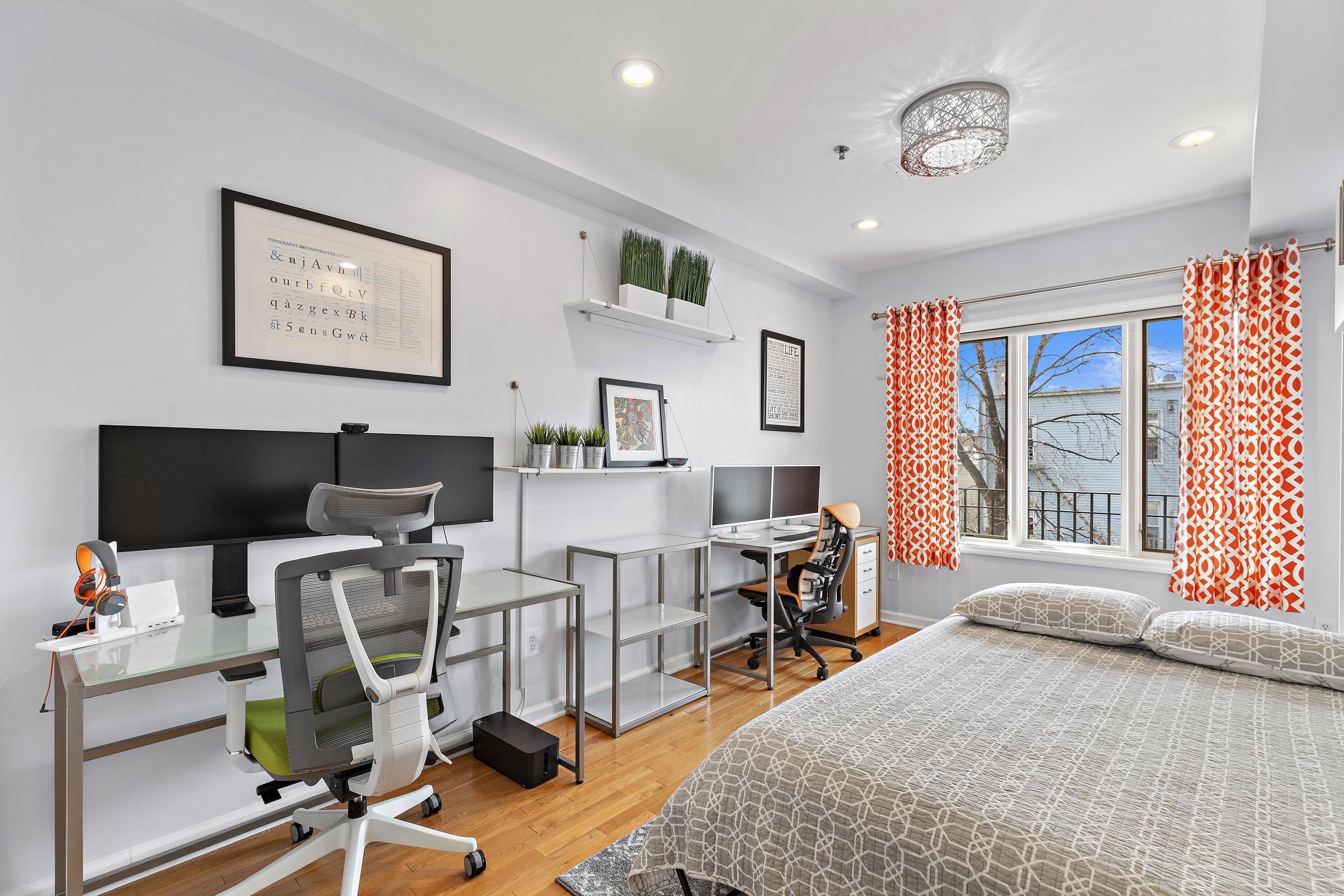 203-207 Hackensack Plank Road, Unit 4B Weehawken, NJ 07086 - Photo 16 of 27 a view of a workspace with furniture and a window