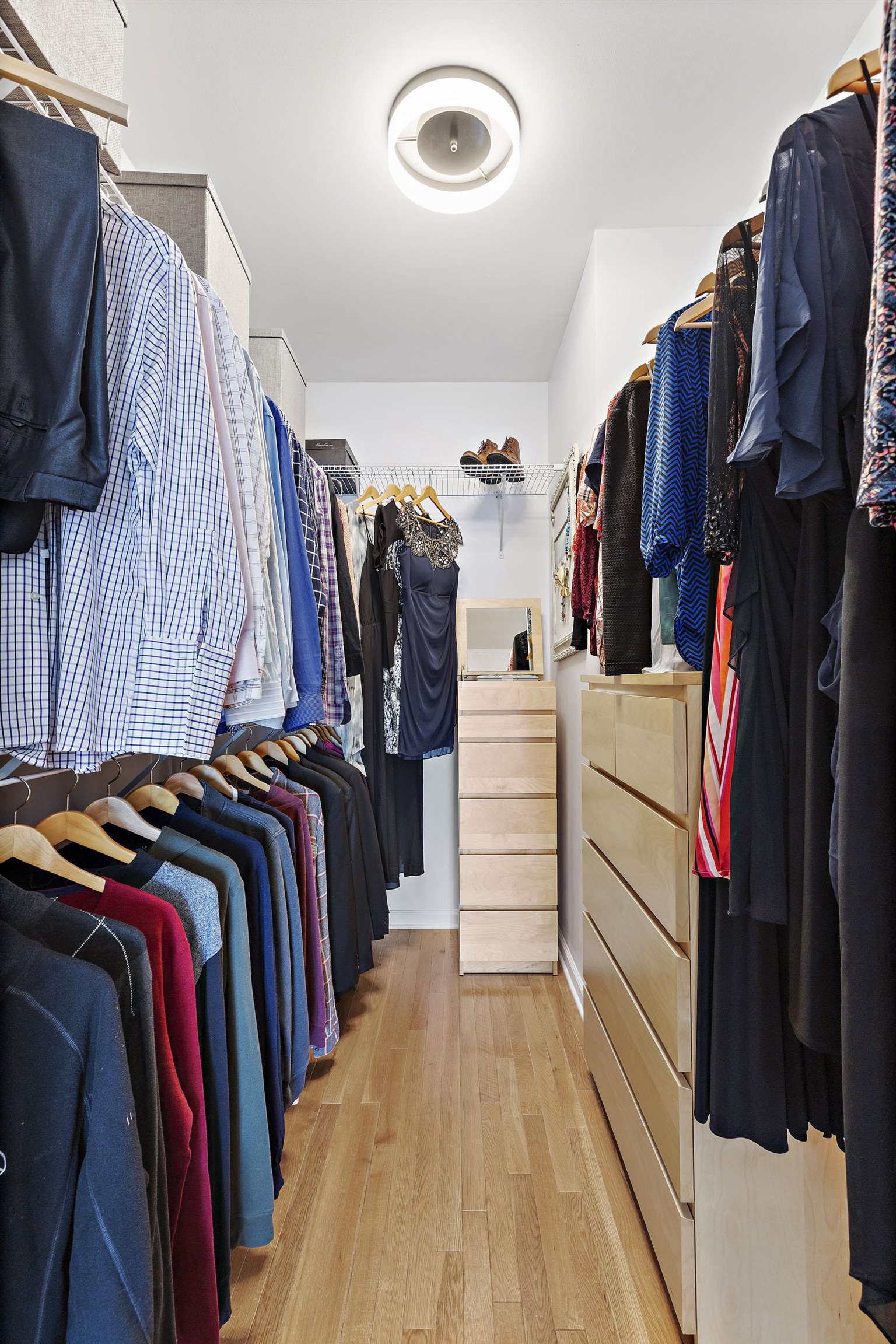 203-207 Hackensack Plank Road, Unit 4B Weehawken, NJ 07086 - Photo 21 of 27 a view of walk in closet with clothes and shoes