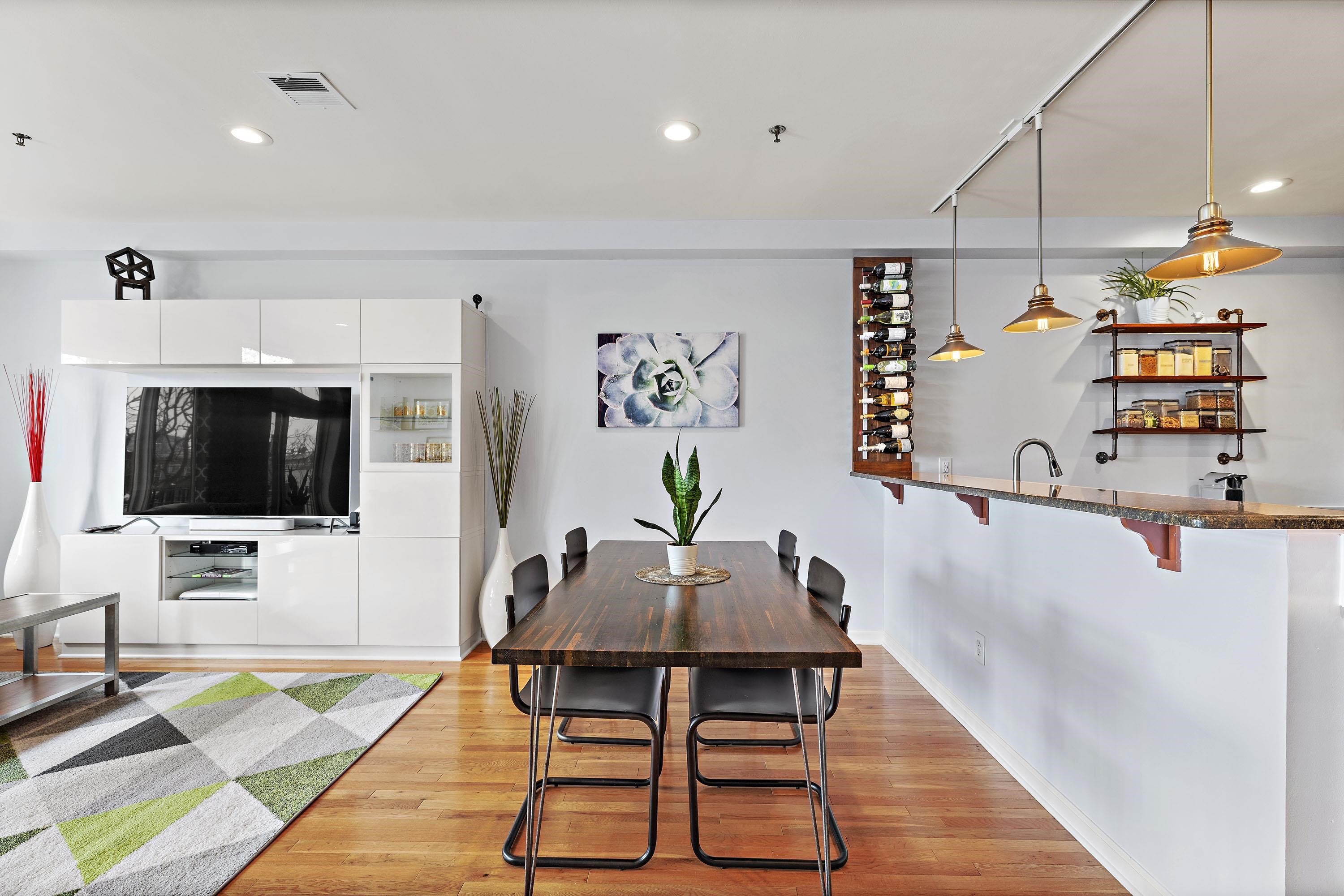 203-207 Hackensack Plank Road, Unit 4B Weehawken, NJ 07086 - Photo 6 of 27 a living room with furniture and a flat screen tv