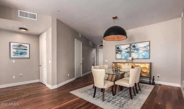 a view of a dining room with furniture window and wooden floor