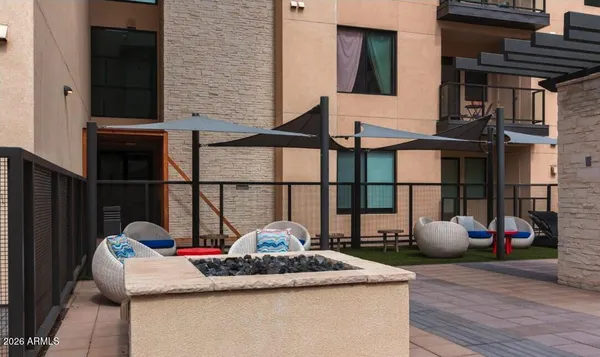 a view of a building with sitting area