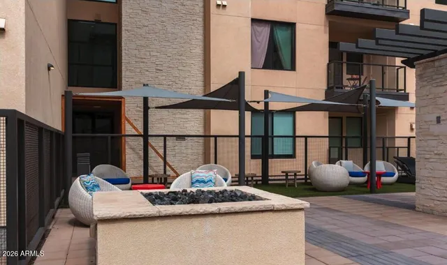 a view of a building with sitting area