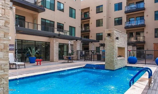 a view of a patio with table and chairs