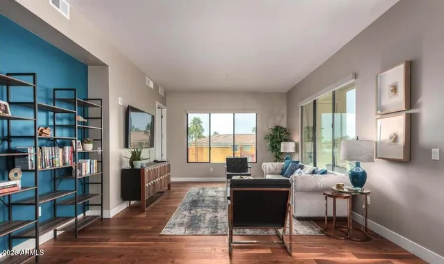 a living room with furniture and a window