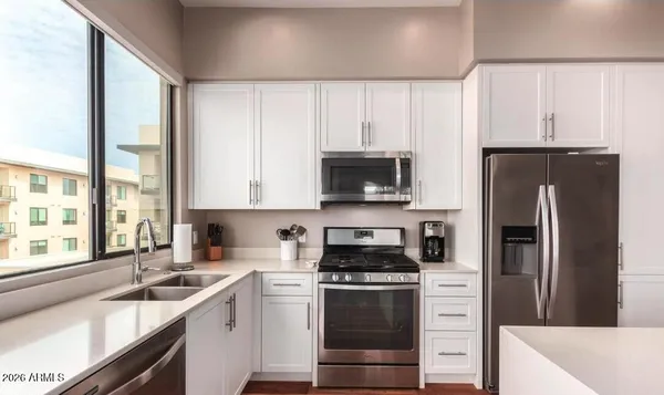 a view of a living room and dining room