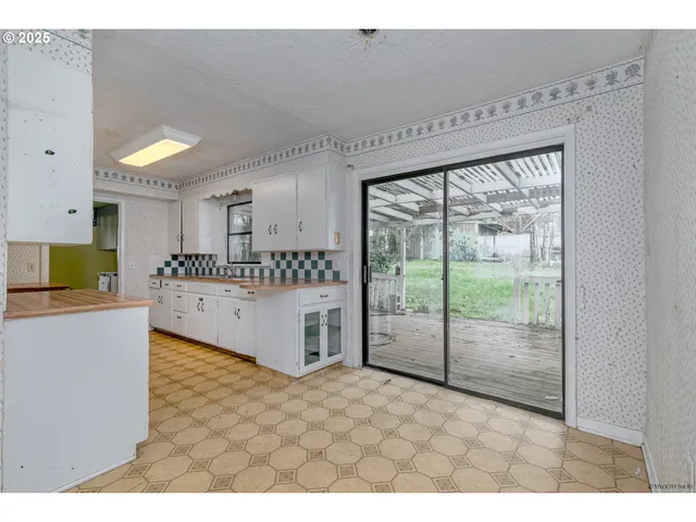 a kitchen with a cabinets and appliances