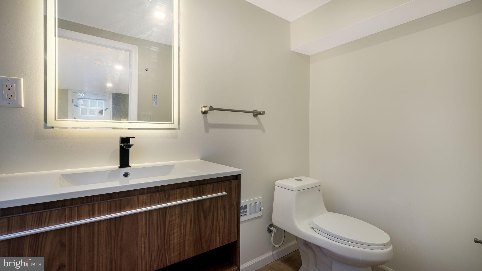 1617 Church Road Wyncote, PA 19095 - Photo 16 of 39 Sleek modern bathroom with natural light.