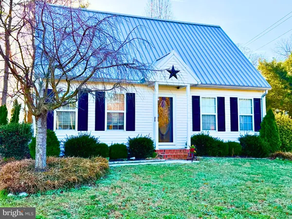 a front view of a house with porch and garden