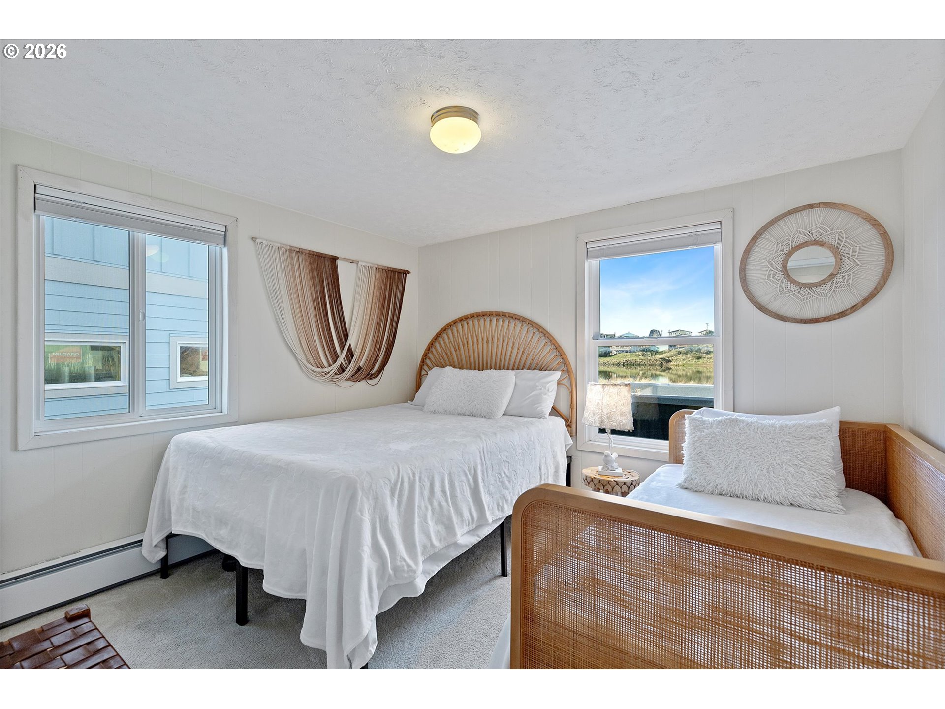 35160 Rueppel Avenue Pacific City, OR 97135 - Photo 18 of 34 a bedroom with a bed and a window