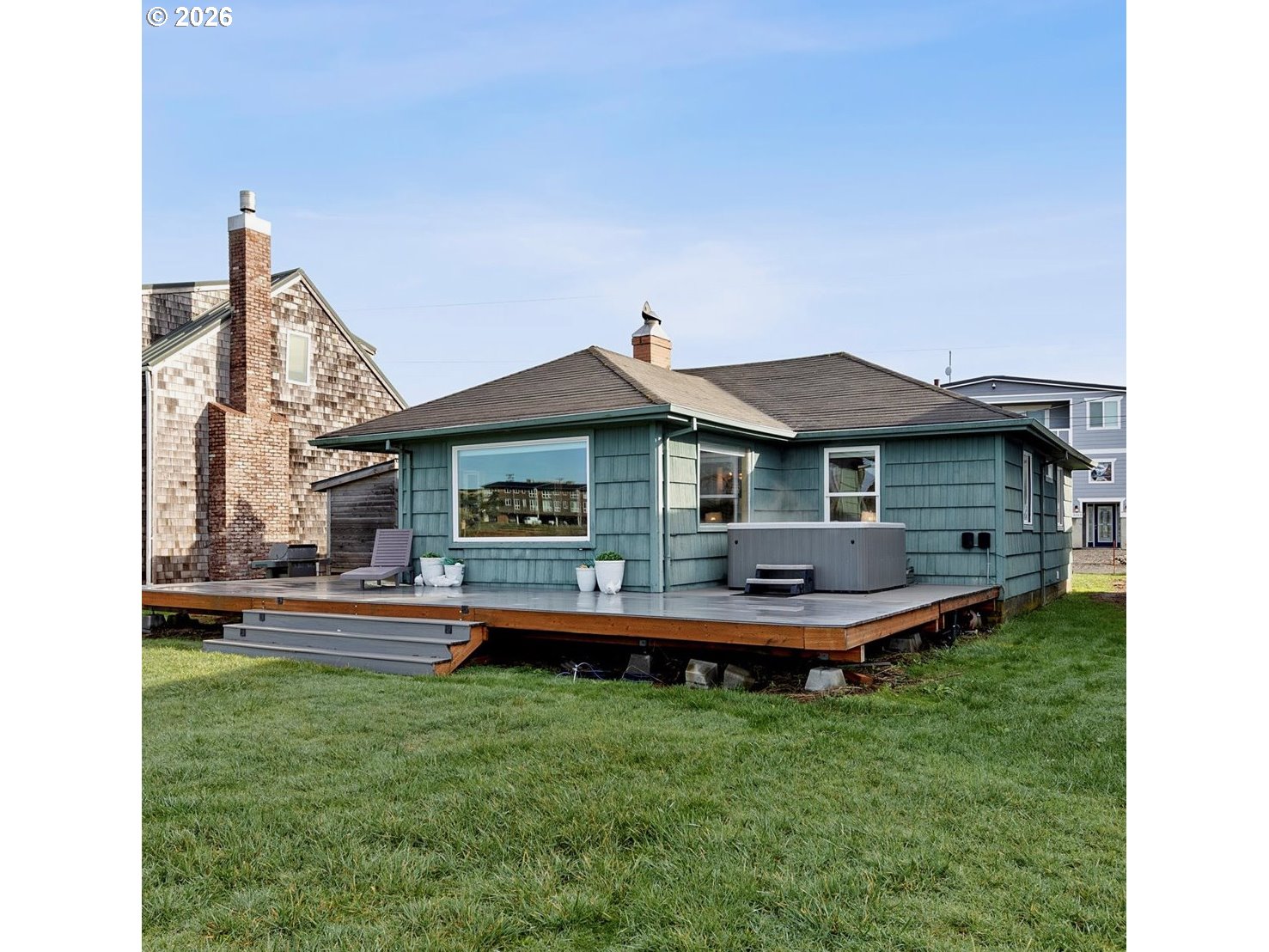 35160 Rueppel Avenue Pacific City, OR 97135 - Photo 2 of 34 a backyard of a house with table and chairs