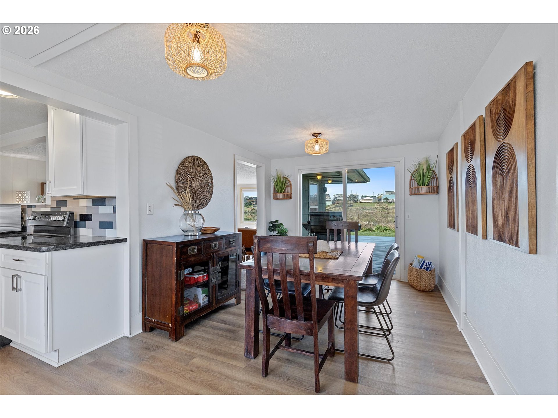 35160 Rueppel Avenue Pacific City, OR 97135 - Photo 5 of 34 a view of a dining room with furniture and wooden floor