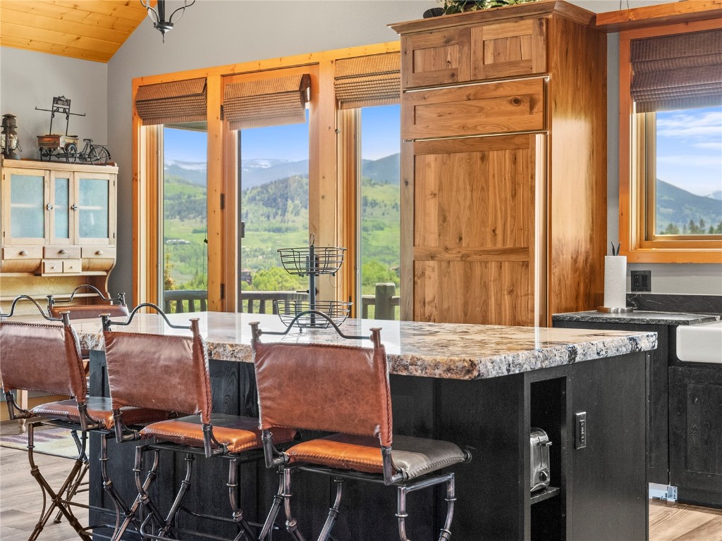 89 Emerald Road Silverthorne, CO 80498 - Photo 14 of 46 a large kitchen with a table and chairs