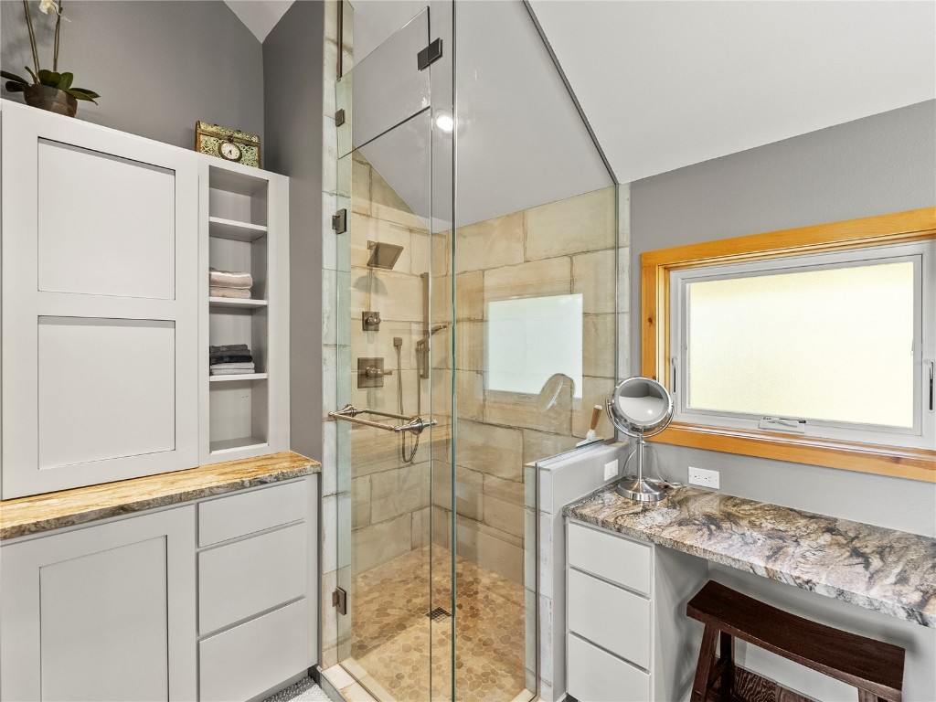 89 Emerald Road Silverthorne, CO 80498 - Photo 18 of 46 a bathroom with a granite countertop sink and a shower