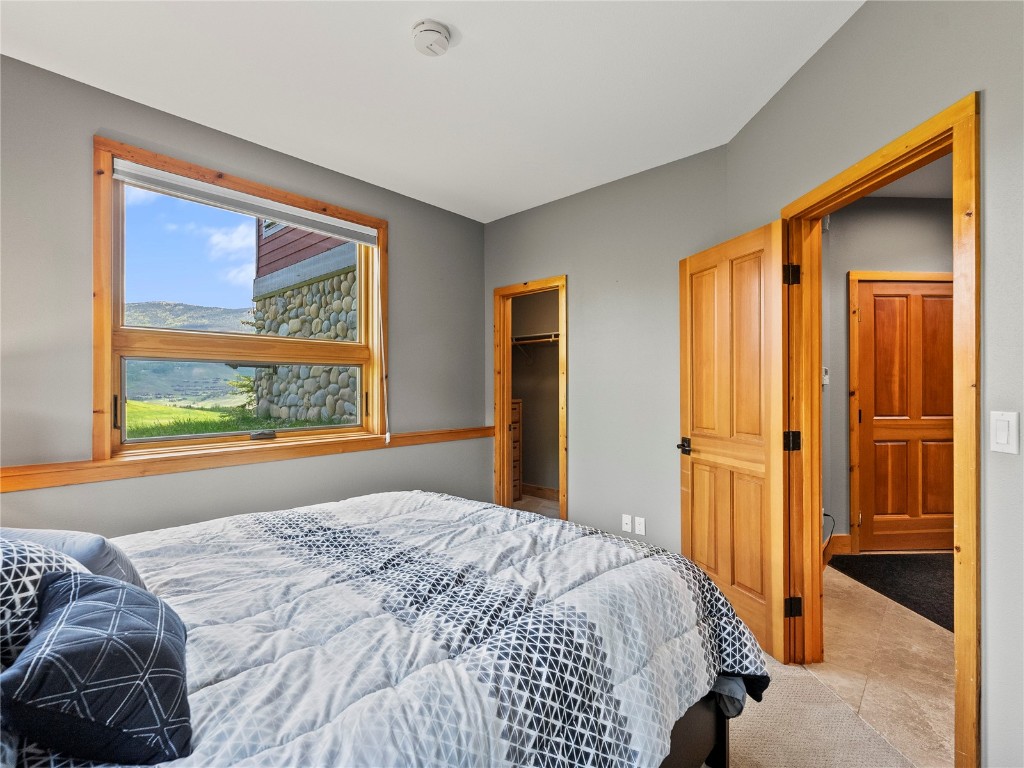 89 Emerald Road Silverthorne, CO 80498 - Photo 22 of 46 a bedroom with a bed and a window