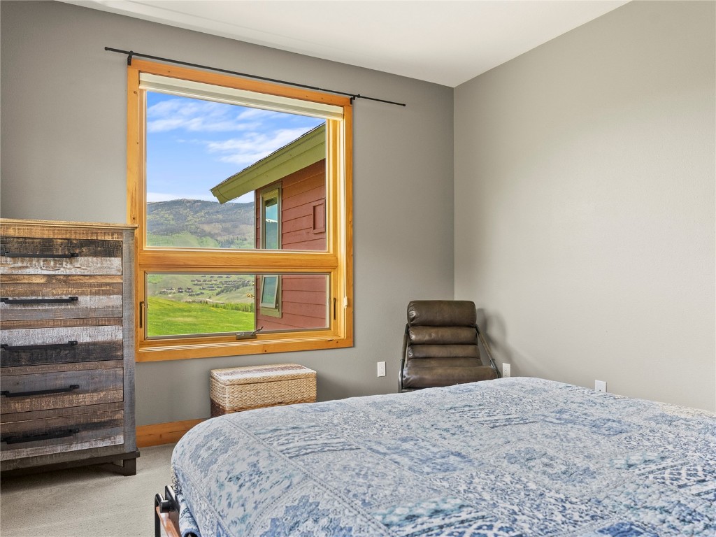 89 Emerald Road Silverthorne, CO 80498 - Photo 25 of 46 a bedroom with a bed and a window