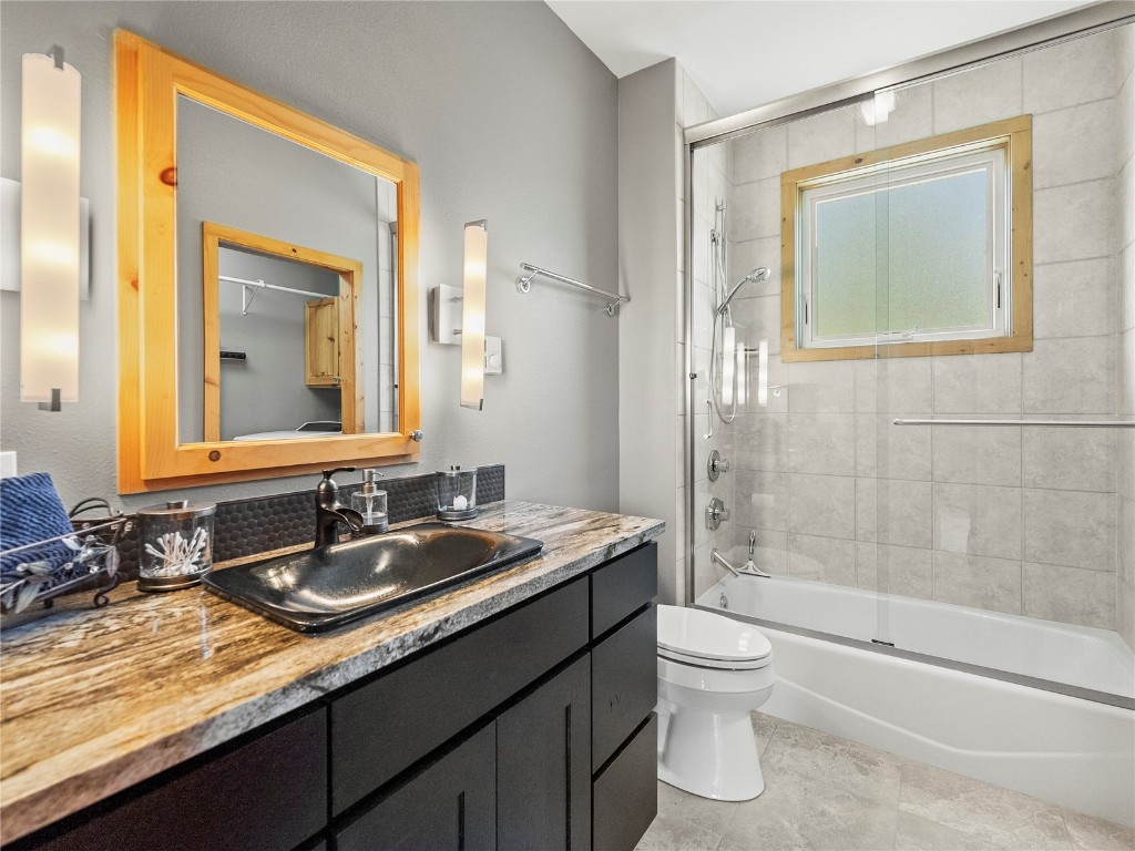 89 Emerald Road Silverthorne, CO 80498 - Photo 29 of 46 a bathroom with a granite countertop sink toilet and shower