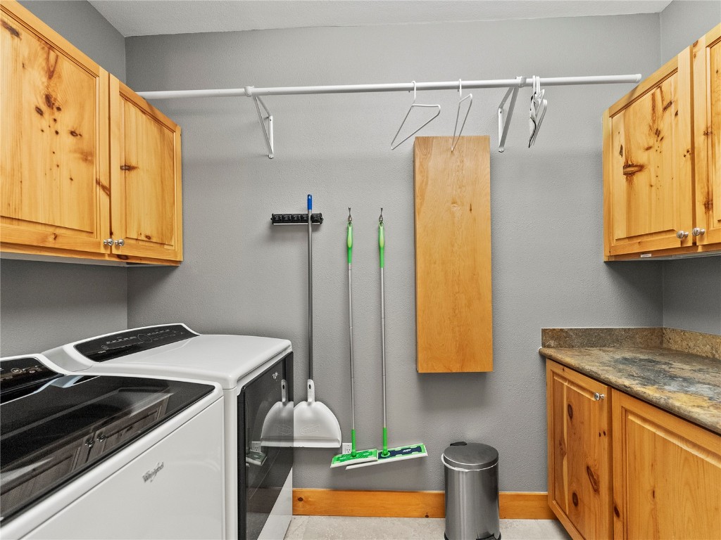 89 Emerald Road Silverthorne, CO 80498 - Photo 30 of 46 a utility room with stainless steel appliances granite countertop a washer and dryer