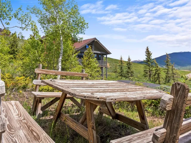 a view of a chairs and table on the deck