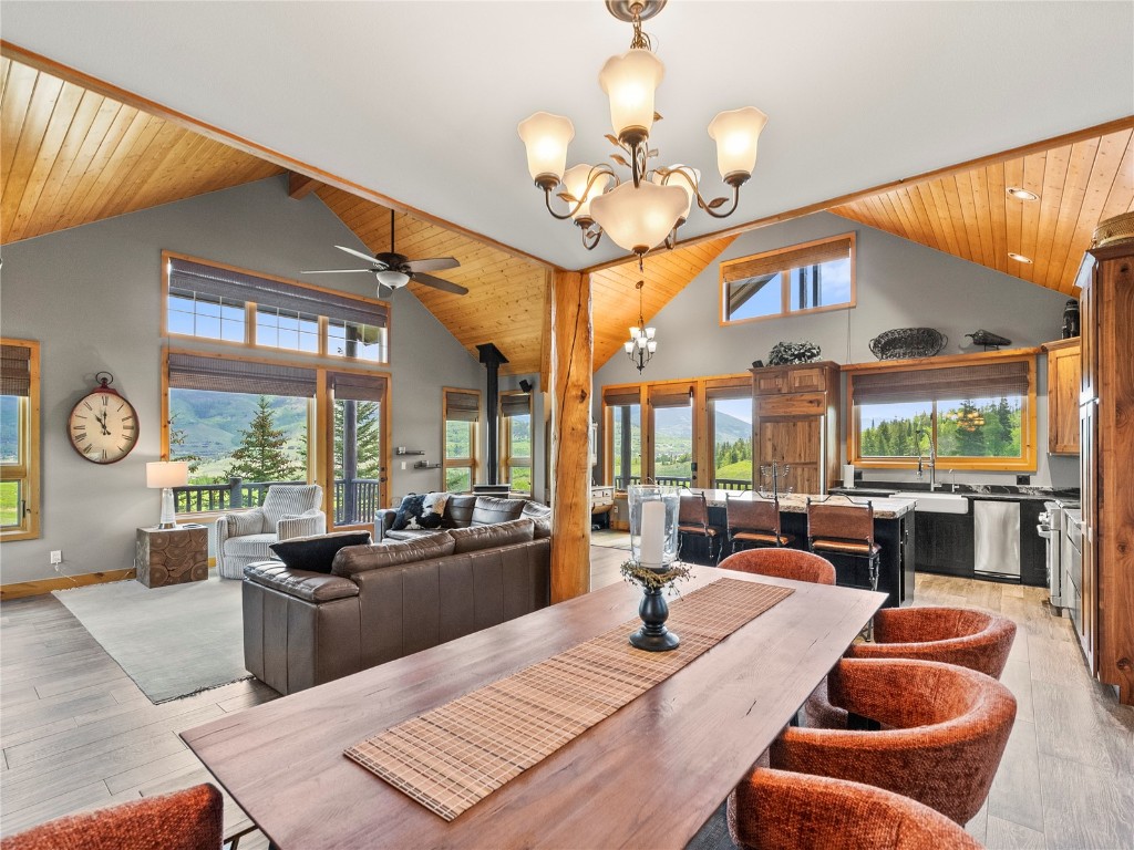 89 Emerald Road Silverthorne, CO 80498 - Photo 7 of 46 a view of a dining room with furniture a chandelier and large windows