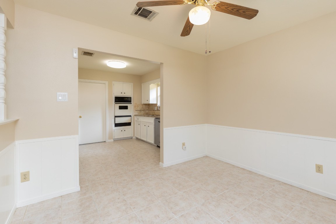 2623 Longleaf Pines Lane Houston, TX 77339 - Photo 11 of 32 wooden floor in an empty room and a kitchen