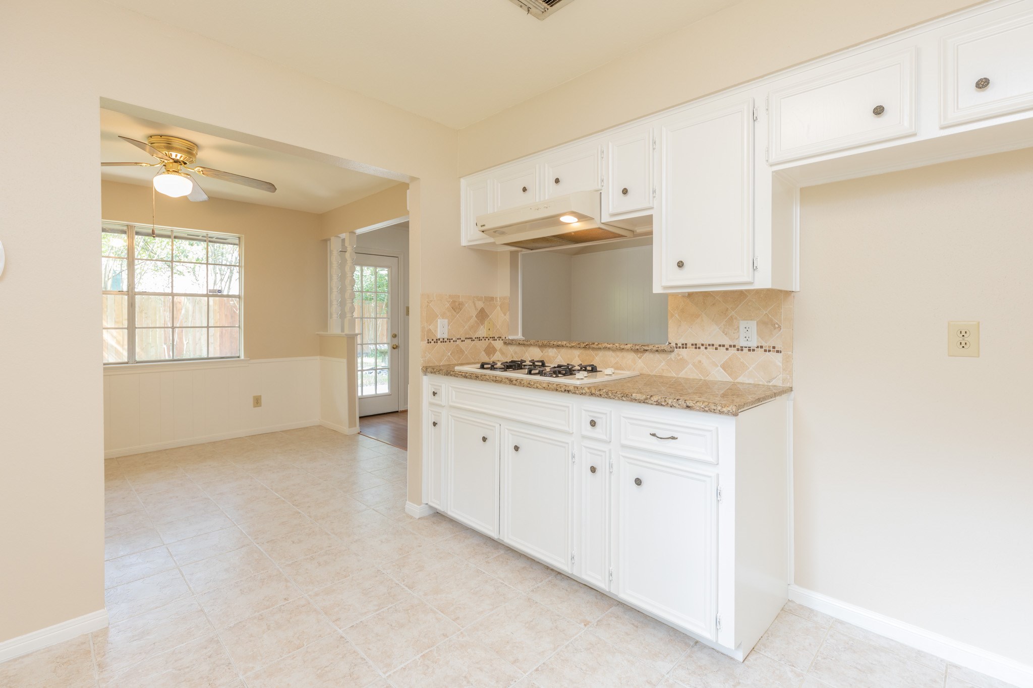2623 Longleaf Pines Lane Houston, TX 77339 - Photo 14 of 32 a view of a kitchen with granite countertop white cabinets and white appliances