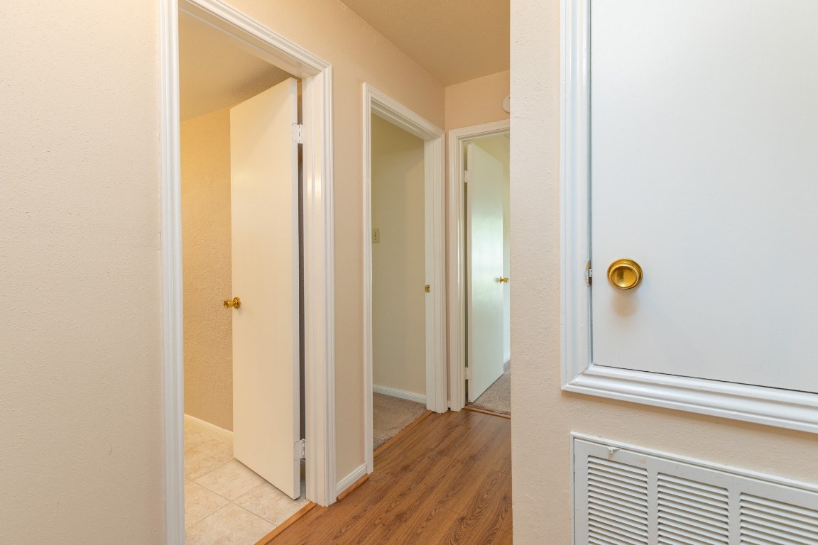 2623 Longleaf Pines Lane Houston, TX 77339 - Photo 16 of 32 a view of a hallway with wooden floor