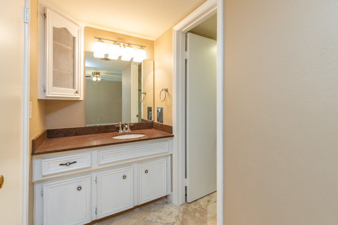 2623 Longleaf Pines Lane Houston, TX 77339 - Photo 21 of 32 a bathroom with a granite countertop sink and a mirror