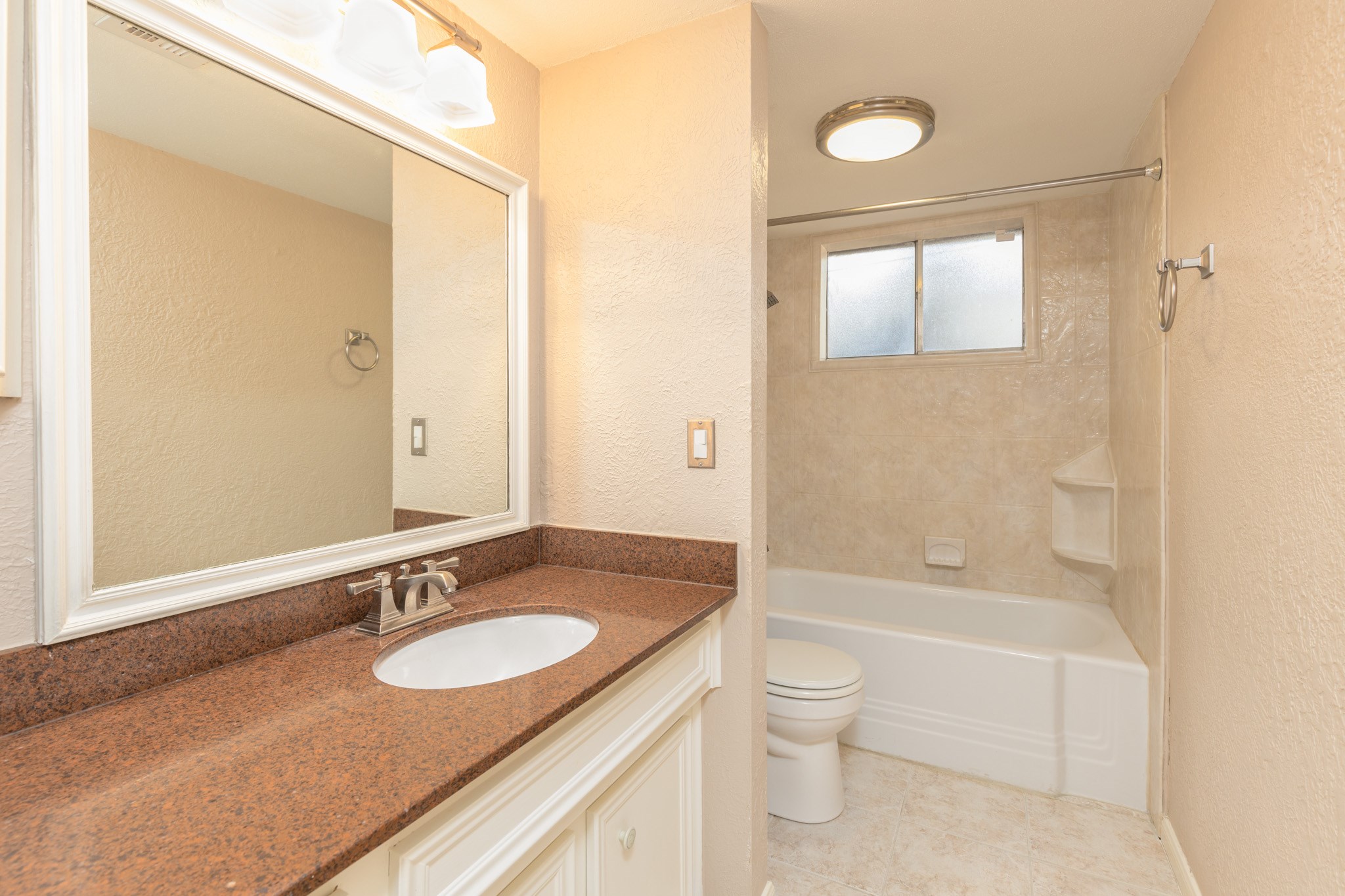 2623 Longleaf Pines Lane Houston, TX 77339 - Photo 26 of 32 a bathroom with a granite countertop sink toilet and shower