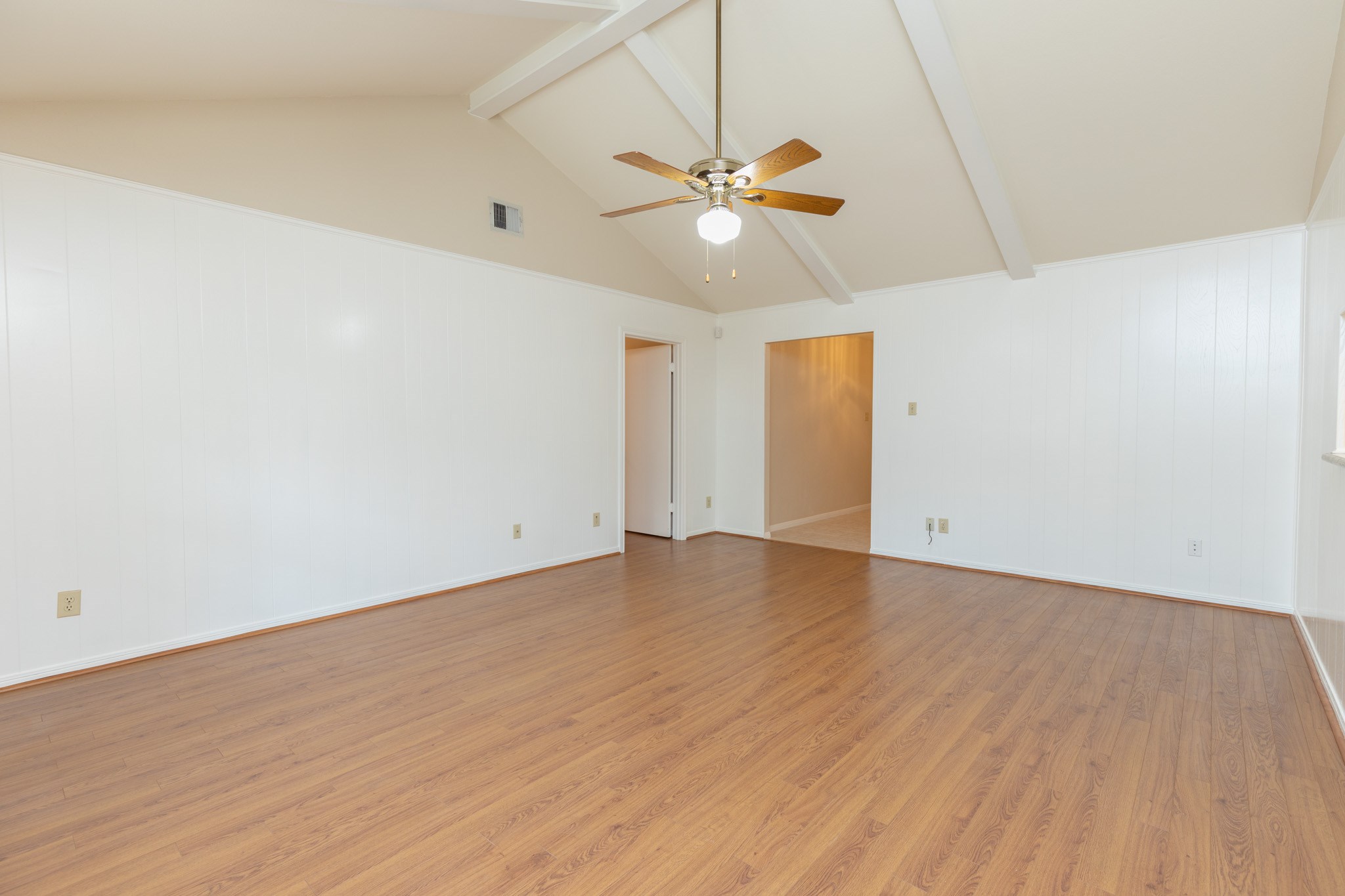 2623 Longleaf Pines Lane Houston, TX 77339 - Photo 7 of 32 an empty room with wooden floor fan and windows