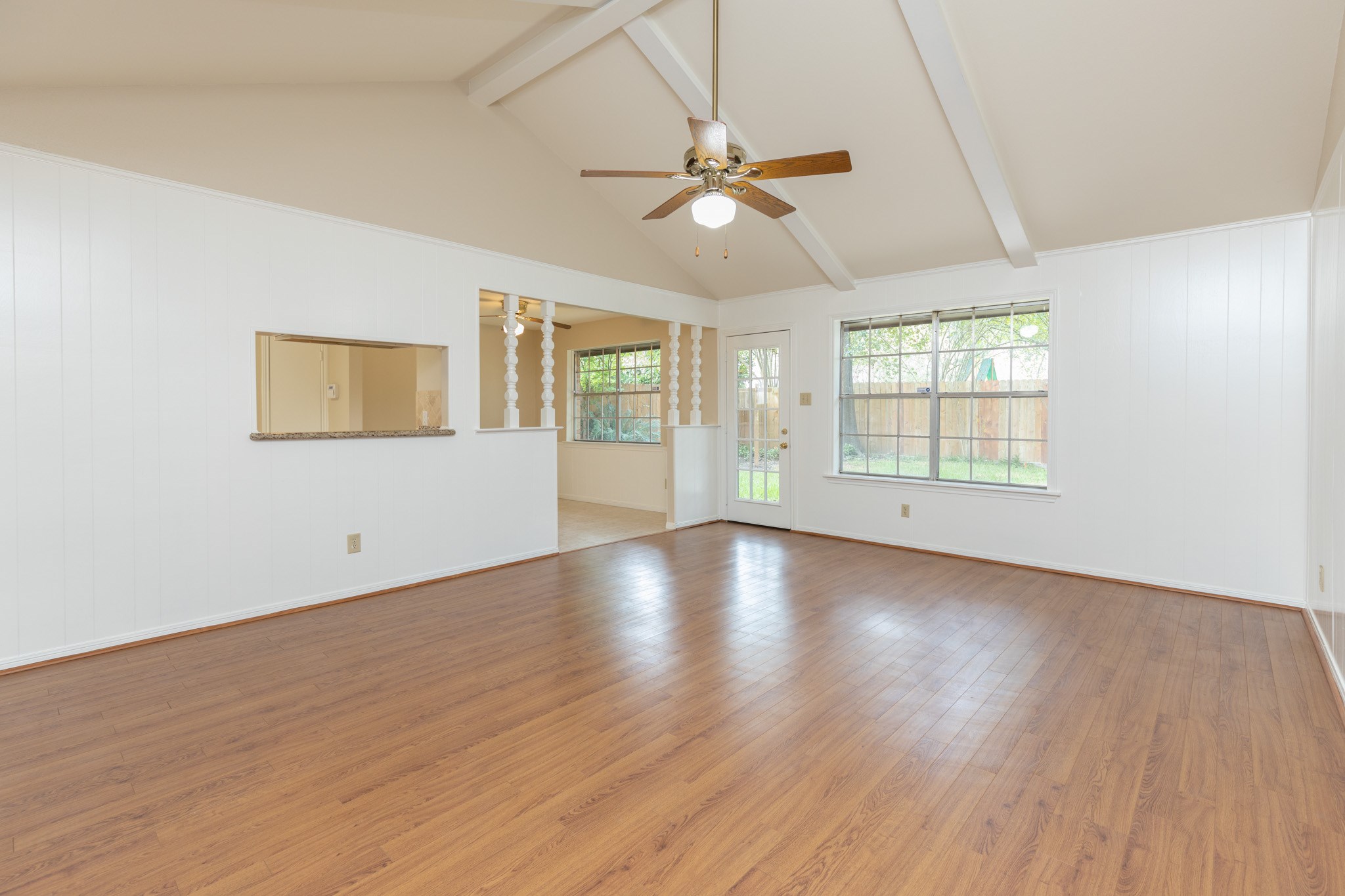 2623 Longleaf Pines Lane Houston, TX 77339 - Photo 8 of 32 a view of an empty room with wooden floor and a window