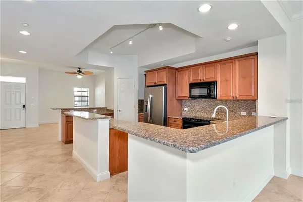 a kitchen with counter top space cabinets and stainless steel appliances