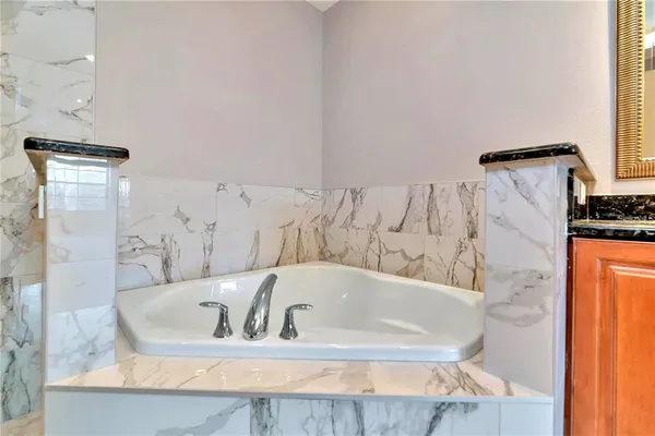 a bath tub sitting next to a bathroom