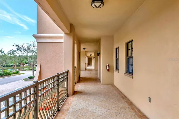 a view of a hallway with windows