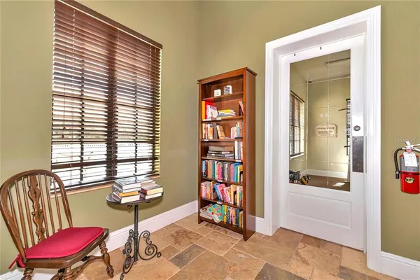 a view of a livingroom with furniture and a window