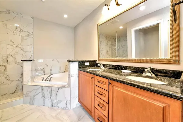 a bathroom with a sink double vanity and a mirror