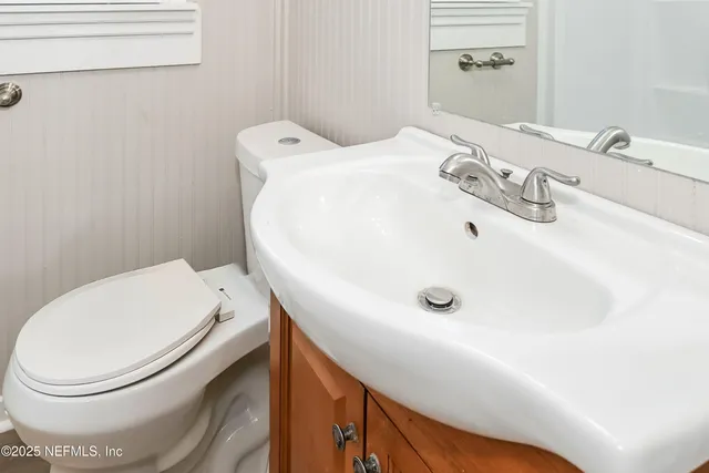 a bathroom with a toilet and sink