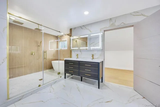 a bathroom with a bathtub and shower