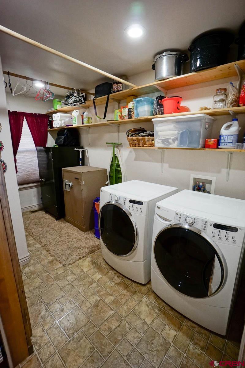 16575 2550th Road Cedaredge, CO 81413 - Photo 11 of 32 a utility room with dryer and washer