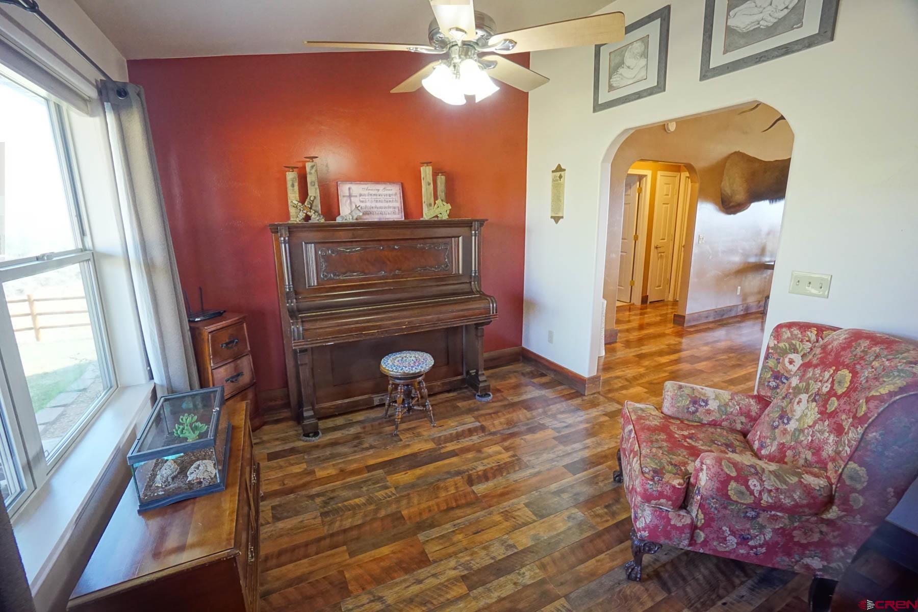 16575 2550th Road Cedaredge, CO 81413 - Photo 3 of 32 a living room with furniture and a fireplace