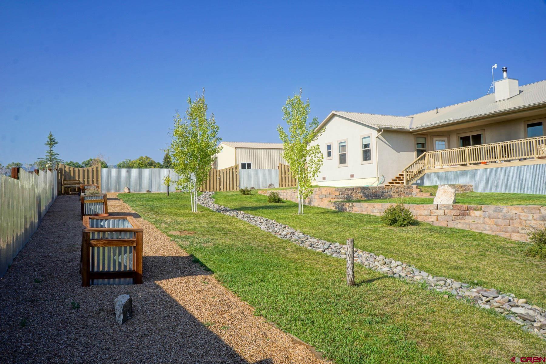 16575 2550th Road Cedaredge, CO 81413 - Photo 27 of 32 a front view of a house with a yard