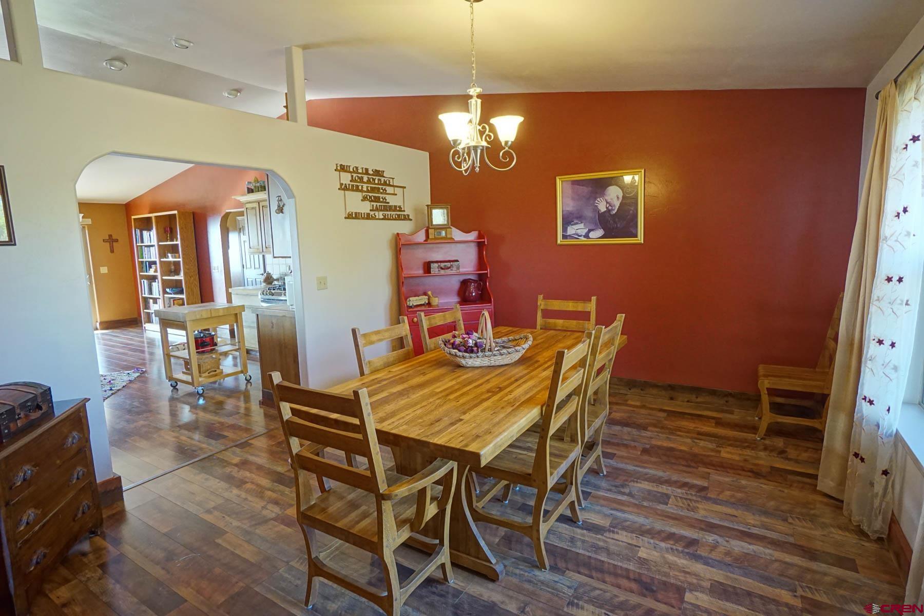 16575 2550th Road Cedaredge, CO 81413 - Photo 4 of 32 a view of a dining room with furniture and wooden floor
