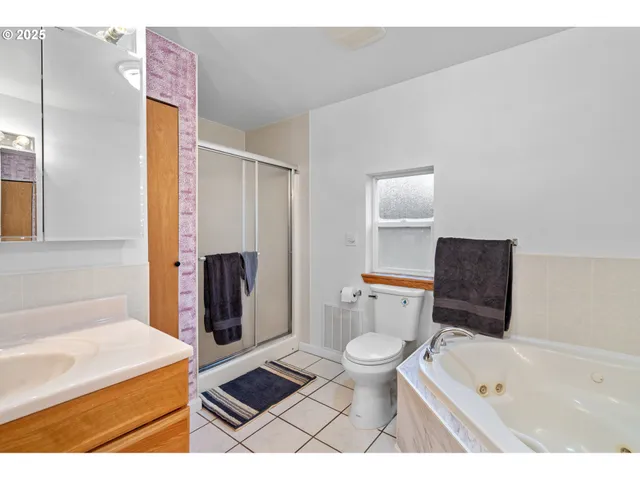a bathroom with a toilet a sink and a bathtub