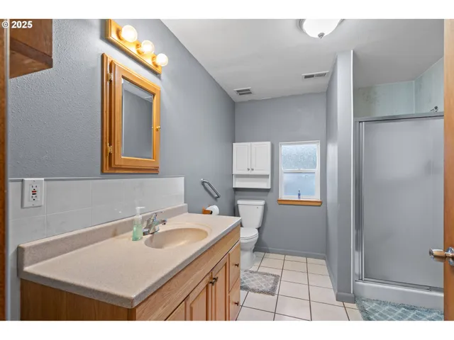 a bathroom with a sink a mirror and a toilet